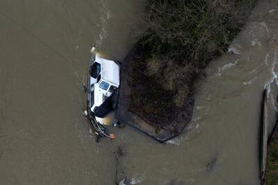 A sunken boat on the Thames in Oxfordshire, as Britain reels from the aftermath of Storm Henk. AP