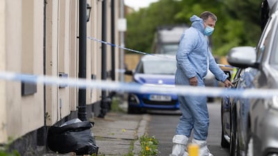 Forensic officers search a house in Rochdale after the arrests. Getty