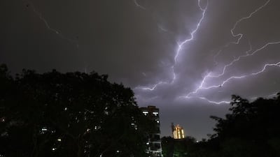 Lightning strikes over residential apartments during storms on the outskirts of the Indian capital New Delhi in May 2018.
