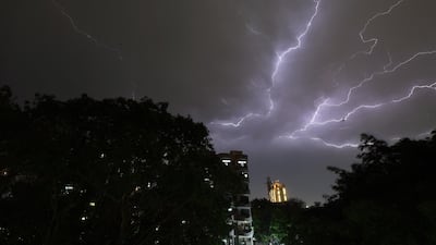 Lightning strikes over residential apartments during storms on the outskirts of the Indian capital New Delhi. Prakash Singh / AFP Photo