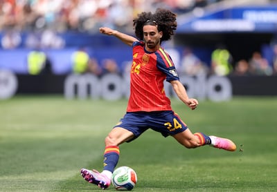Marc Cucurella, who kisses his personalised shin guards four times before each match, in action for Spain against Belgium. Getty Images