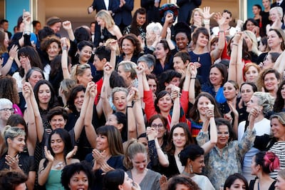 Actresses and female directors stand on the steps of the red carpet in protest of the lack of female filmmakers honored throughout the history of the Cannes Film Festival. Getty Images