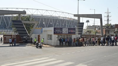 Fans collect their tickets for the third Test which begins at the Sardar Patel Stadium in Ahmedabad from February 24. AFP