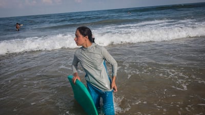 For many Gazans the sea is the only place they can be without being reminded of their isolation. Female Surfer, Sabah Abu Ghanem,14, and her sister surf early in the morning outside of Gaza city. The sisters place first in many competitions inside the strip, but have never left the Gaza Strip to compete. Courtesy Monique Jaques