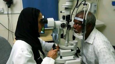 Dr Manal Taryam, an Emirati ophthalmology consultant with Dubai Health Authority, examines a patient at Rashid Hospital's outpatient clinic. Jeffrey E Biteng / The National