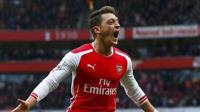 Arsenal's Mesut Ozil celebrates his goal against Aston Villa during their English Premier League match at the Emirates Stadium in London, February 1, 2015. REUTERS/Eddie Keogh