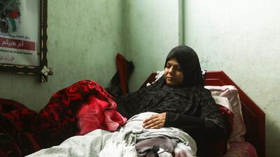Malina Al Hindi lies in her bed in Khan Younis, Gaza, after being wounded by an Israeli sniper an in the Great March of Return protests. Wilson Fache for The National
