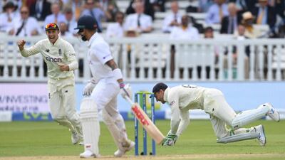 Joe Root celebrates after Jos Buttler caught Virat Kohli at Lord's on Sunday.