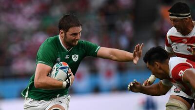 Ireland's lock Iain Henderson (L) runs as Japan's centre Ryoto Nakamura (2R) and Japan's lock Luke Thompson (R) go to tackle during the Japan 2019 Rugby World Cup Pool A match between Japan and Ireland at the Shizuoka Stadium Ecopa in Shizuoka. AFP