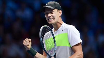 Tomas Berdych celebrates after defeating Jo-Wilfried Tsonga at the ATP Tour Finals
