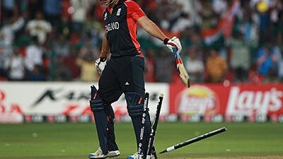 Tim Bresnan clatters his stumps with his bat after being bowled out for 14 by Piyush Chawala in the 48th over.