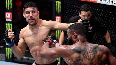 Vicente Luque punches Tyron Woodley in their welterweight fight. Jeff Bottari / USA TODAY Sports / Reuters