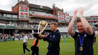 England's Eoin Morgan, right, and England's Joe Root celebrate with the trophy at the Oval in London, one day after they won the Cricket World Cup in a final match against New Zealand. AP Photo
