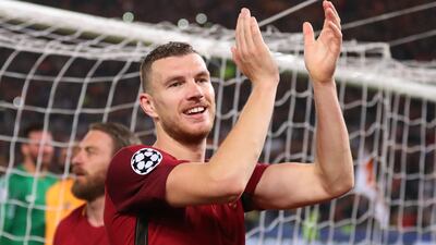 Edin Dzeko scored in both legs against Barcelona as Roma advanced to the semi-finals of the Uefa Champions League. Catherine Ivill / Getty Images