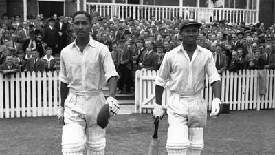 West Indies cricketers Frank Worrell, left, and Everton Weekes go out to bat against England at Trent Bridge. Getty