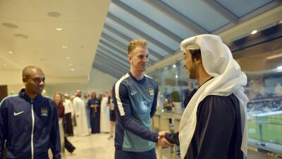 Sheikh Mansour meets Manchester City player Joe Hart after the match
