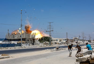 Smoke and flames in the aftermath of an Israeli strike on Al Zuwaida, Gaza. Reuters