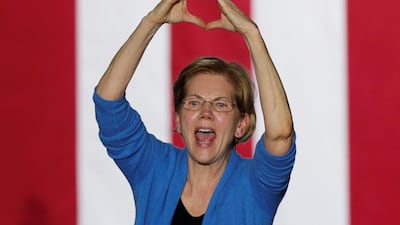 Democratic U.S. presidential candidate Senator Elizabeth Warren makes a heart gesture as she addresses supporters at her Super Tuesday night rally in Detroit, Michigan, U.S. REUTERS