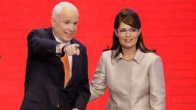 John McCain, the Republican US presidential nominee, joins his running-mate Sarah Palin on stage during the Republican National Convention.
