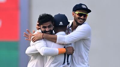 India's Ravindra Jadeja, left, celebrates with teammates after taking the wicket of New Zealand captain Kane Williamson. AFP