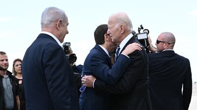 Israeli President Isaac Herzog greets US President Joe Biden at Tel Aviv's Ben Gurion Airport on October 18. AFP