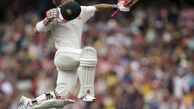 Australia's David Warner jumps in the air to celebrate making 100 runs against Pakistan during their cricket Test match in Sydney, Australia on January 3, 2017. Rick Rycroft / AP