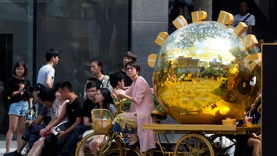 A tricycle painted gold and used as a marketing gimmick in Beijing. China's trade growth weakened in July in a negative sign for growth in the world's second-largest economy and global demand. Ng Han Guan / AP