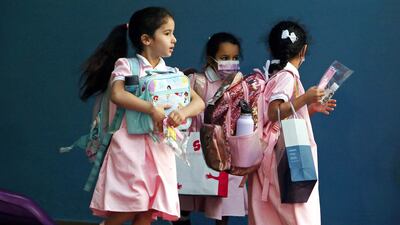 Pupils arrive at school as in-person classes resume after Covid-19 pandemic lockdowns in Kuwait City in September. AFP