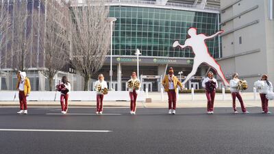 Cheerleaders don the new Washington Commanders logo outside of Fedex Field. Willy Lowry / The National.