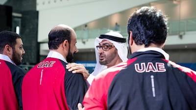 Sheikh Mohamed bin Zayed presents a medal to an athlete during the Special Olympics World Games Abu Dhabi 2019.