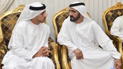 Sheikh Mohammed bin Rashid speaks with Sheikh Mansour bin Zayed, Minister of Presidential Affairs and Deputy Prime Minister, as they visit the families of the UAE's fallen soldiers. Wam