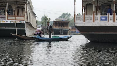A man selling milk on Dal Lake. Priti Salian for The National