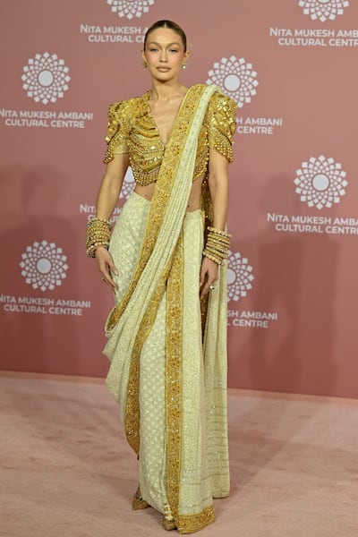 Gigi Hadid in a sari by Abu Jani and Sandeep Khosla. AFP