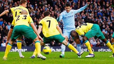 Even with what seems like the entire Norwich City defence around him, Sergio Aguero, centre, could not be stopped.