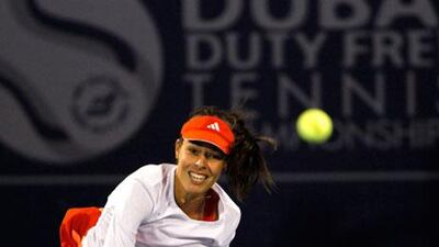 Ana Ivanovic held her cool in the second set, despite a fightback from Francesca Schiavone, to win her first-round match in Dubai.