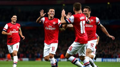 Arsenal may revisit the positions of Mesut Ozil and Aaron Ramsey to bolster the midfield. Paul Gilham / Getty Images