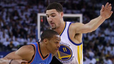 Golden State's Klay Thompson guards Oklahoma City's Russell Westbrook during the Warriors' win in the NBA on Monday night. Ezra Shaw / Getty Images / AFP / January 5, 2015