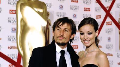 Olivia Wilde, in a black strapless sweetheart bust gown, and Tao Ruspoli arrive at the Romy Gala 2010 at the Hofburg Palace in Vienna, Austria, on April 17, 2010.