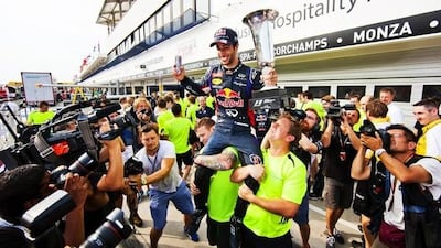 Daniel Ricciardo is held aloft by Red Bull team members after his win in Hungary. Drew Gibson / Getty Images