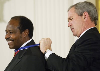 Paul Rusesabagina receives the Presidential Medal of Freedom, America's highest civilian award, from then President George W Bush at the White House in November 2005. AFP