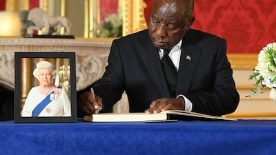 South African President Cyril Ramaphosa signs a book of condolence at Lancaster House in London on September 18, after the death of Queen Elizabeth II. PA