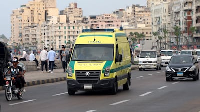 An ambulance leaves the site in Alexandria where a policeman opened fire on Israeli tourists. AP Photo