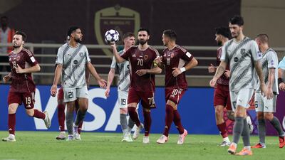 Al Wahda captain Omar Khribin celebrates after scoring from the penalty spot.