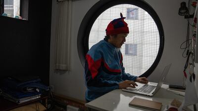 Filmmaker Masa Yoshikawa works in his room at the tower, which was constructed in the 1970s. Getty