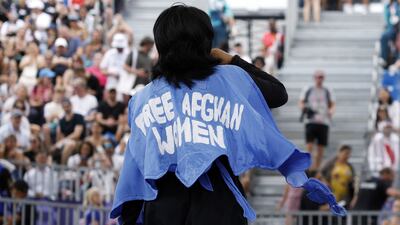 Olympic refugee team member Manizha Talash wore a cape that reads 'Free Afghan women' during the women's breaking qualifying round at the Paris Olympics. AFP