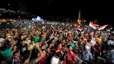 Syrian government backers and rebel supporters alike roared with joy on Tuesday when Omar Al Soma scored a 93rd-minute goal, giving their national team a 2-2 draw with Iran. Omar Sanadiki / Reuters