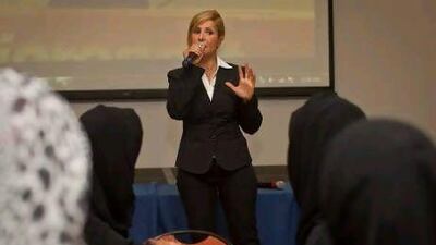 Sherry Farzami, Project Manager at the British Council, lectures at a skills employability workshop for young women at Fujairah Women's College.