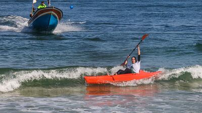A Palestinian woman takes part in a local canoeing championship, off the coast of Gaza city.