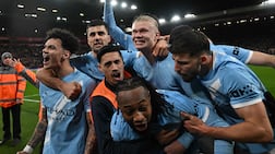 Teammates celebrate after Manchester City's Norwegian striker #09 Erling Haaland (C) scored his team's second goal during the English Premier League football match between Liverpool and Manchester City at Anfield in Liverpool, north west England on February 8, 2026. (Photo by Paul ELLIS / AFP) / RESTRICTED TO EDITORIAL USE. No use with unauthorized audio, video, data, fixture lists, club/league logos or 'live' services. Online in-match use limited to 120 images. An additional 40 images may be used in extra time. No video emulation. Social media in-match use limited to 120 images. An additional 40 images may be used in extra time. No use in betting publications, games or single club/league/player publications. /