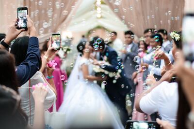 It's not uncommon for the couple and their friends to put up live feeds of a a wedding on social media